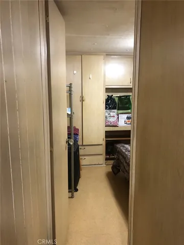 a bedroom with a bed and a mirror