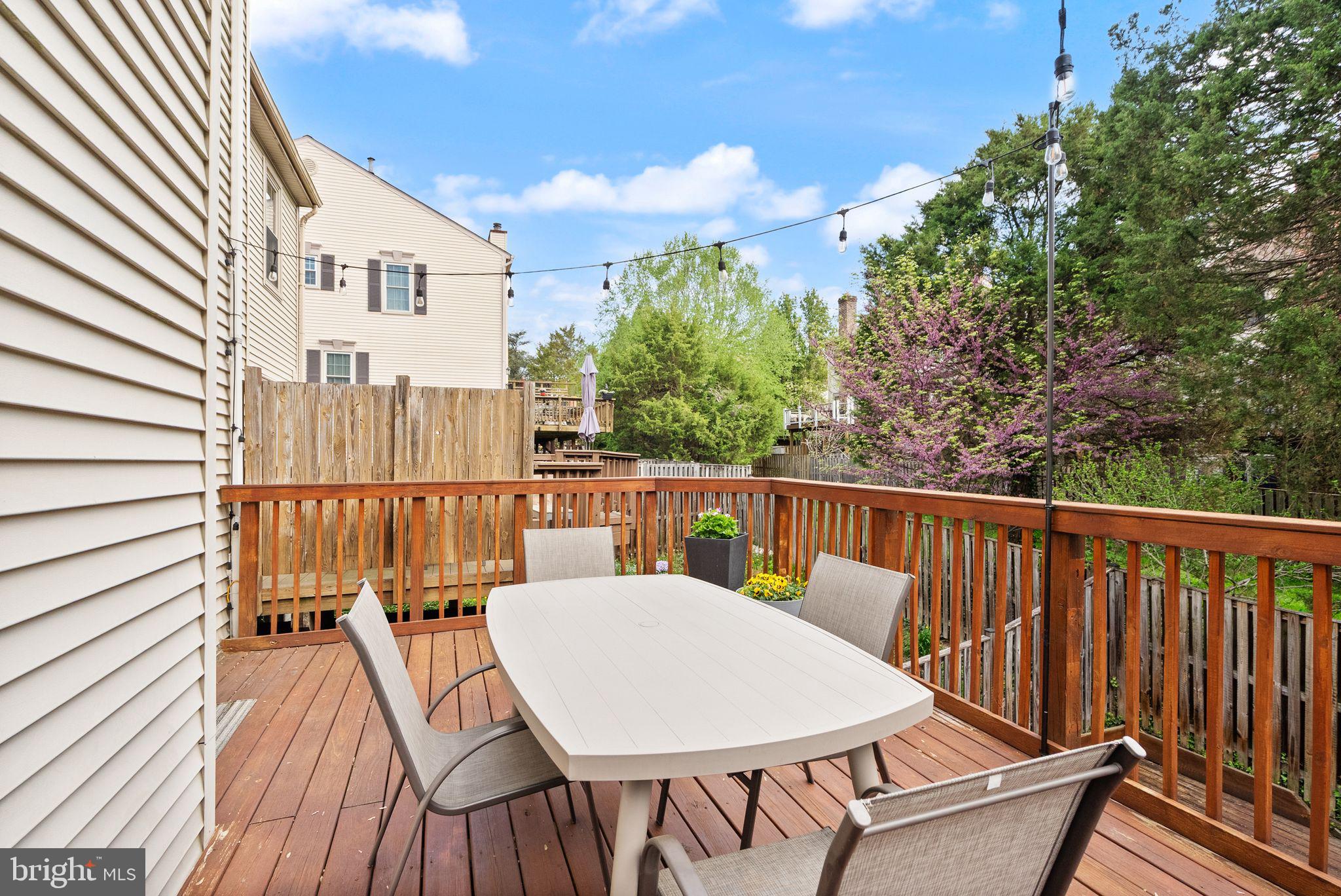 6369 English Ivy Way Springfield, VA 22152 - Photo 53 of 62 a view of a balcony with table and chairs