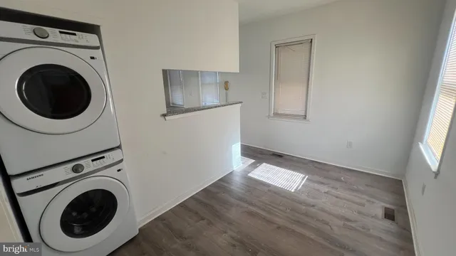 a view of a hallway with washer and dryer