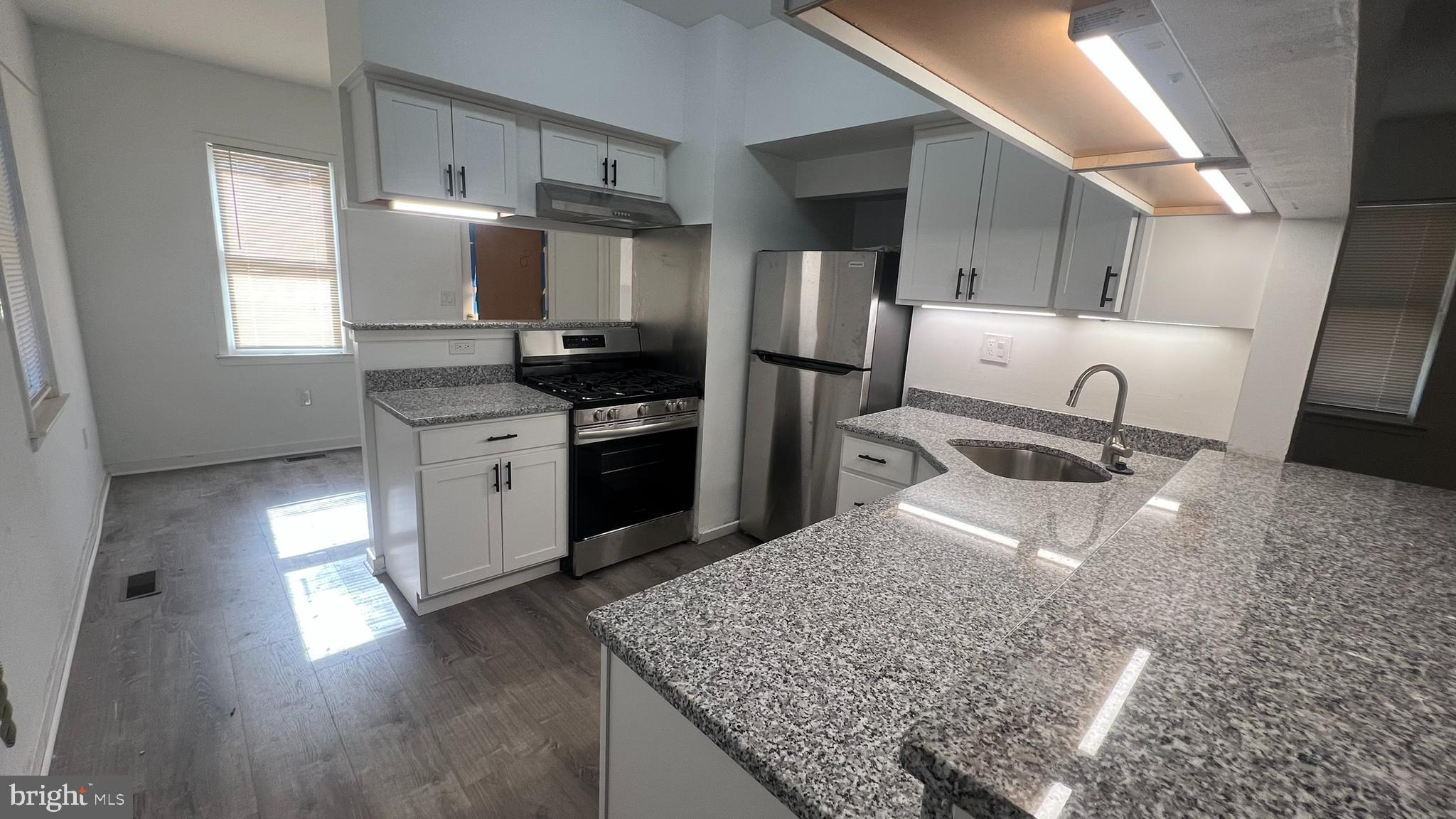 58 Chews Landing Road Clementon, NJ 08021 - Photo 8 of 21 a kitchen with stainless steel appliances granite countertop a sink stove and refrigerator