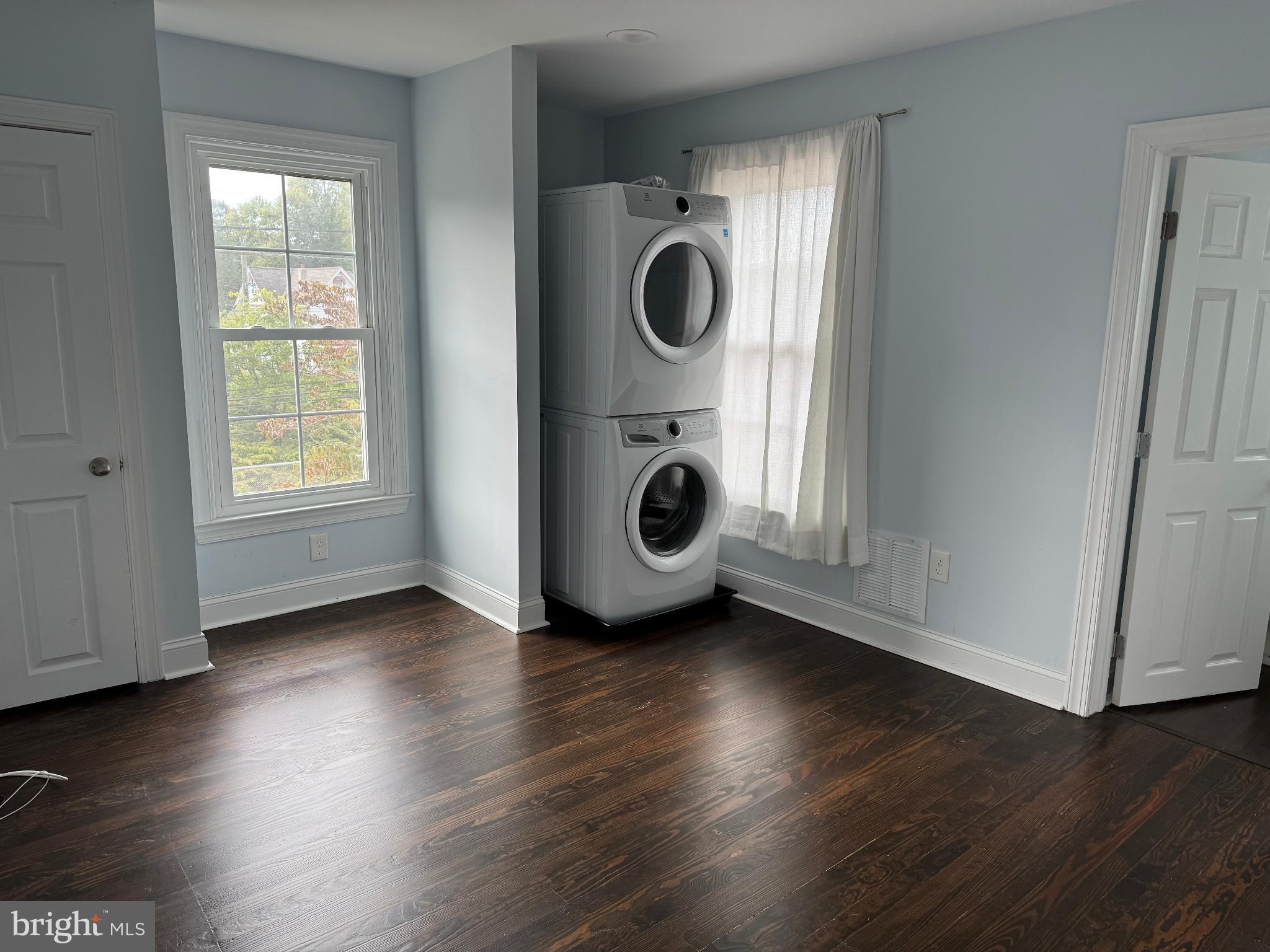 237 South Atlantic Avenue, Unit B Haddonfield, NJ 08033 - Photo 5 of 10 an empty room with wooden floor and window