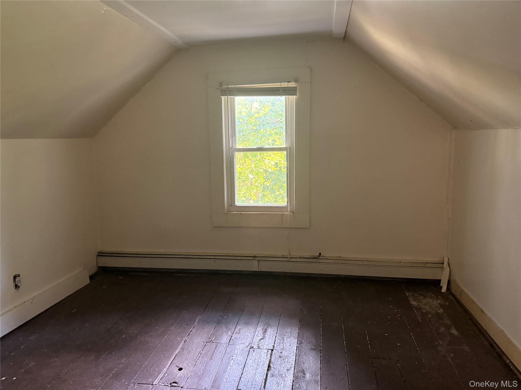 3968 Old Crompond Road Cortlandt Manor, NY 10567 - Photo 15 of 17 Additional living space featuring dark wood finished floors, lofted ceiling, and a baseboard heating unit