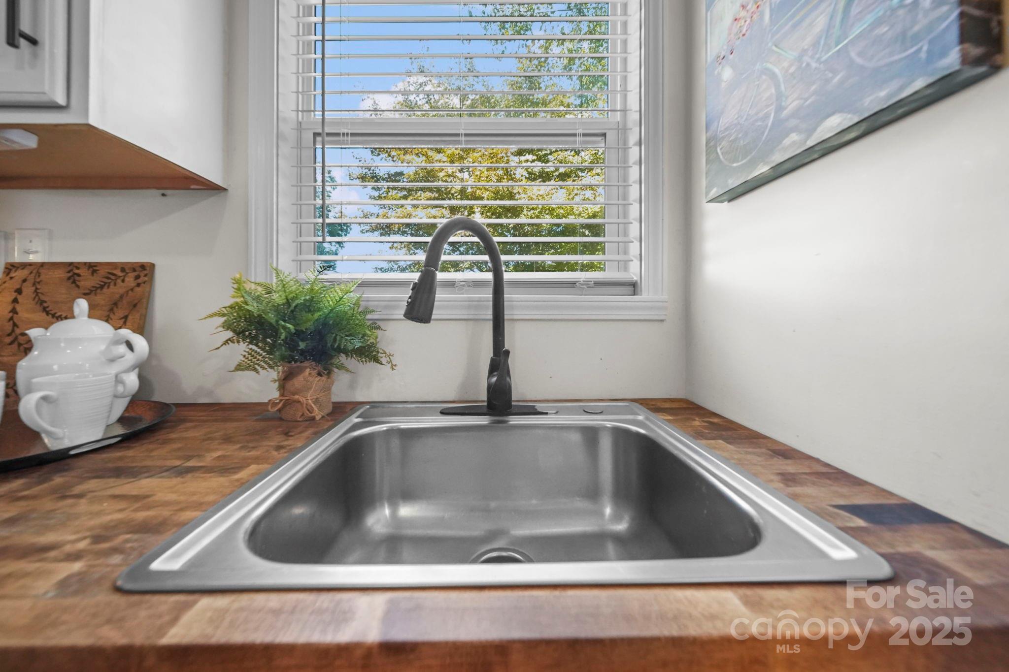 452 18th Street Cramerton, NC 28032 - Photo 13 of 35 a close view of sink and tap