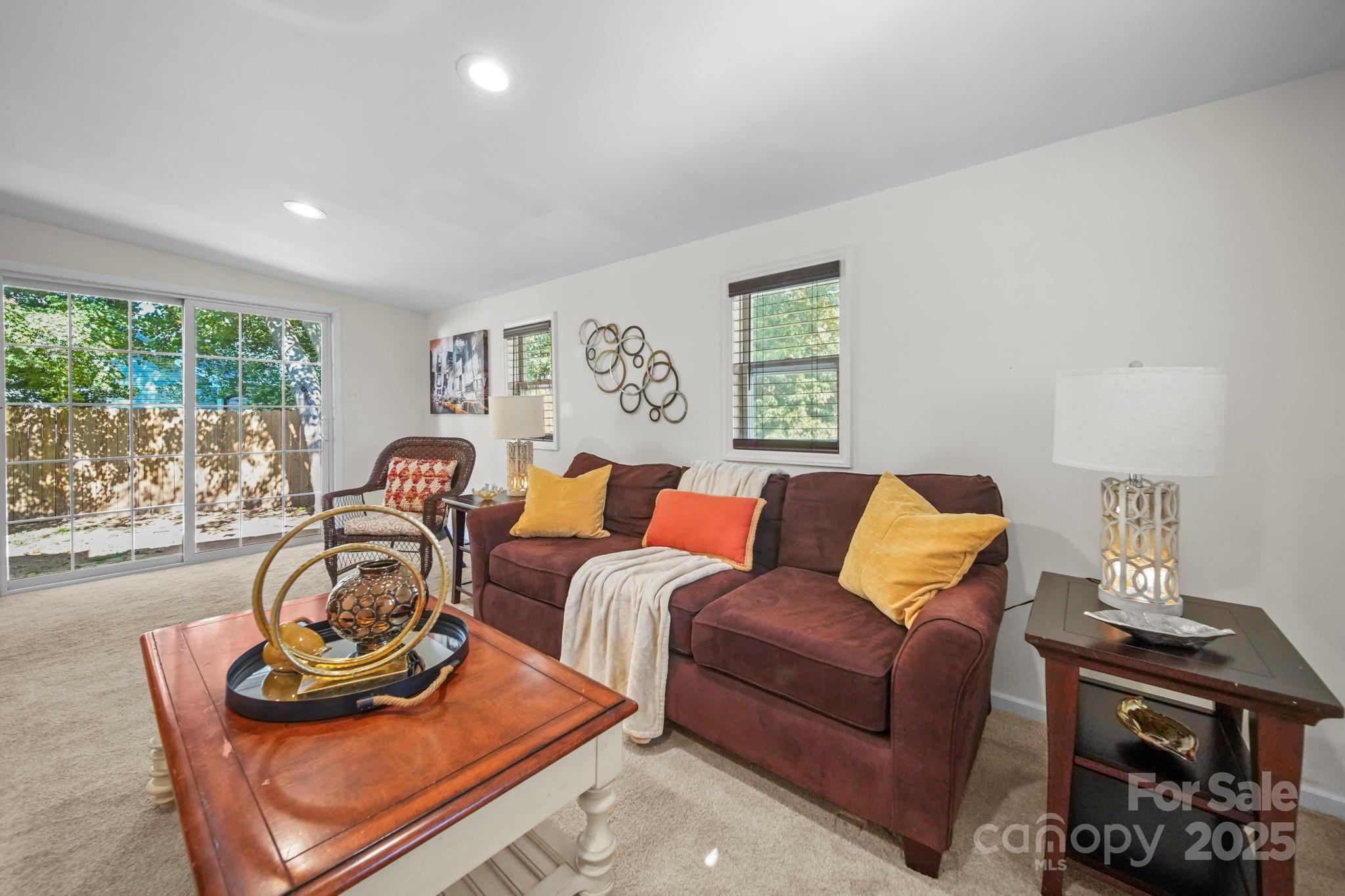 452 18th Street Cramerton, NC 28032 - Photo 15 of 35 a living room with furniture a window and a lamp