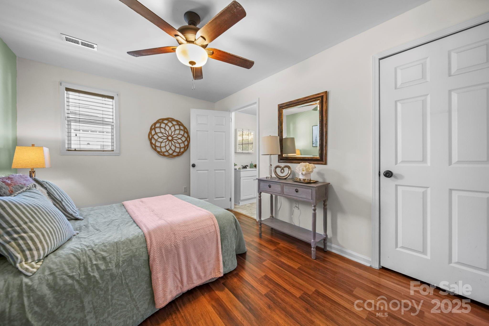 452 18th Street Cramerton, NC 28032 - Photo 18 of 35 a bedroom with a bed and a chandelier