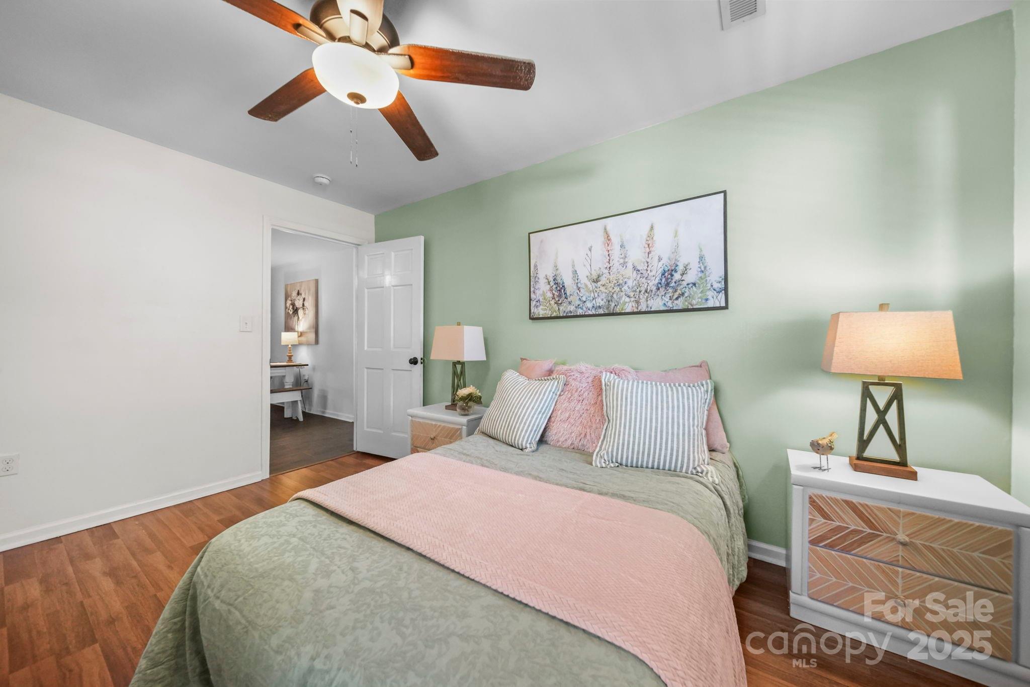 452 18th Street Cramerton, NC 28032 - Photo 20 of 35 a bedroom with a bed and a lamp