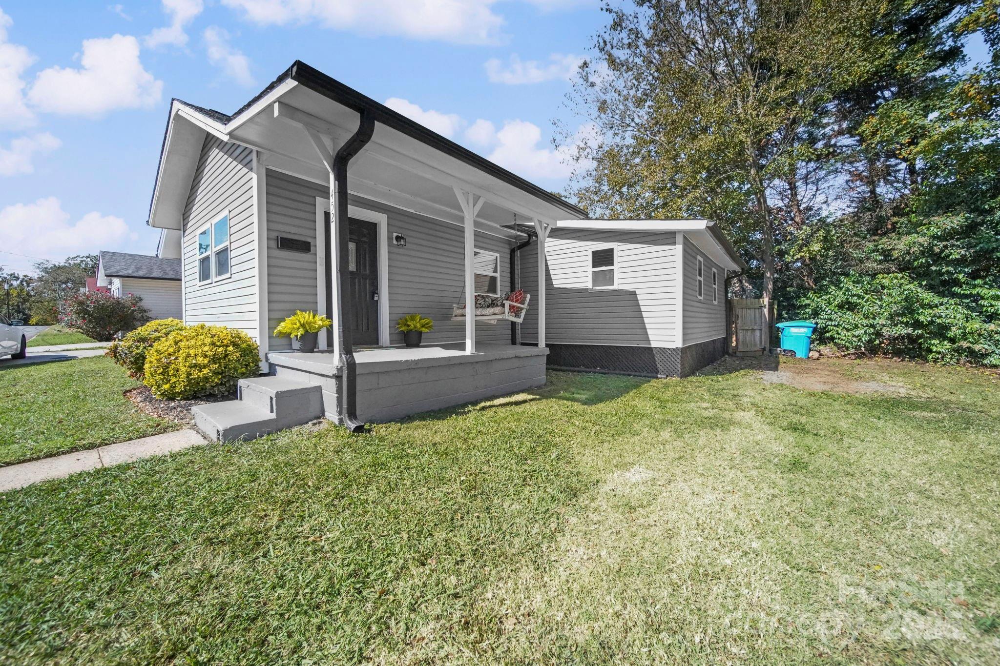 452 18th Street Cramerton, NC 28032 - Photo 2 of 35 a front view of a house with garden