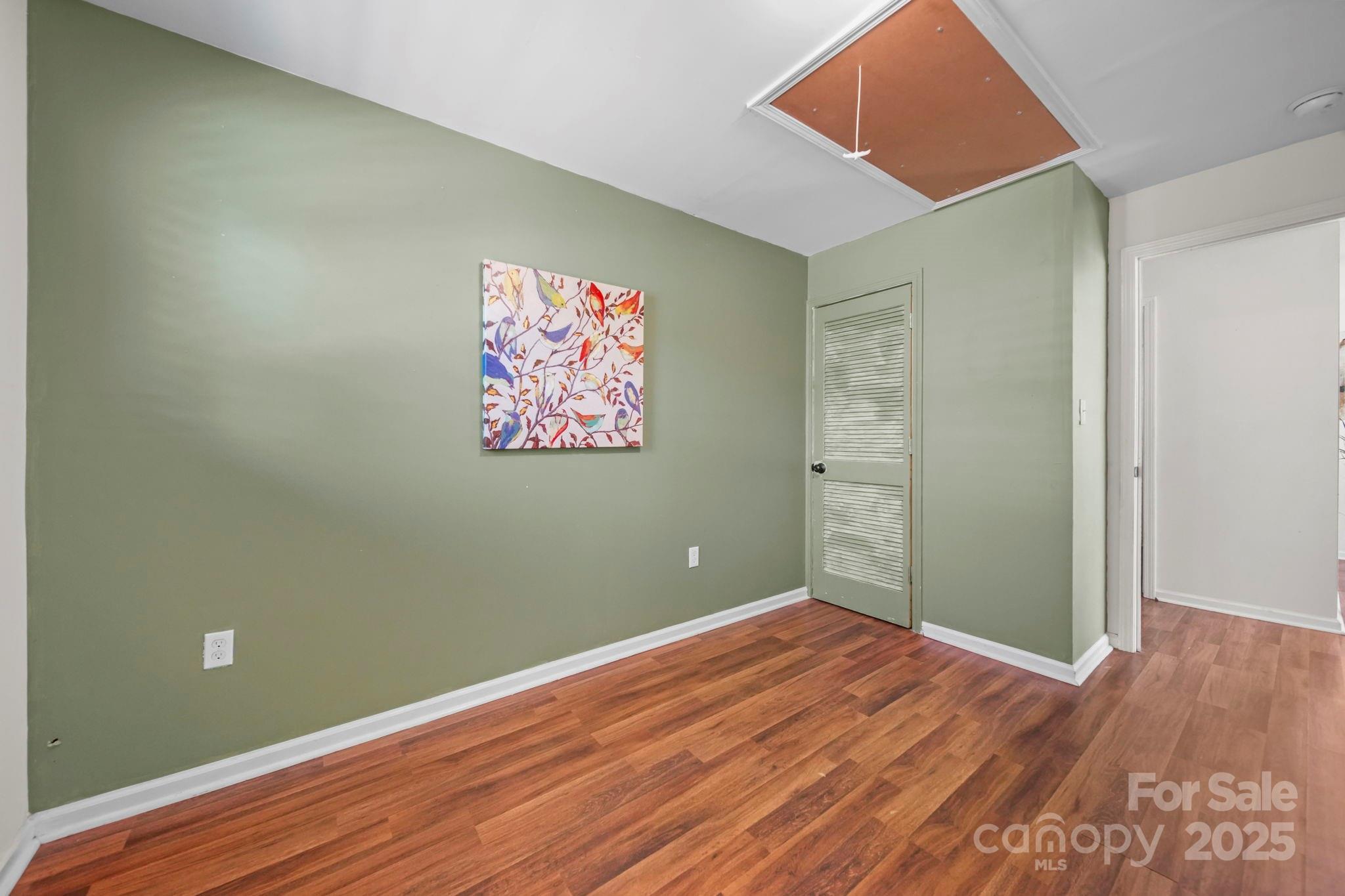 452 18th Street Cramerton, NC 28032 - Photo 24 of 35 an empty room with wooden floor and closet