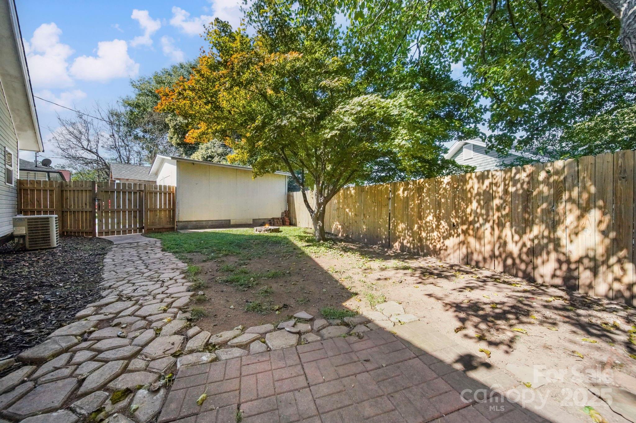 452 18th Street Cramerton, NC 28032 - Photo 30 of 35 a view of a yard with plants and trees
