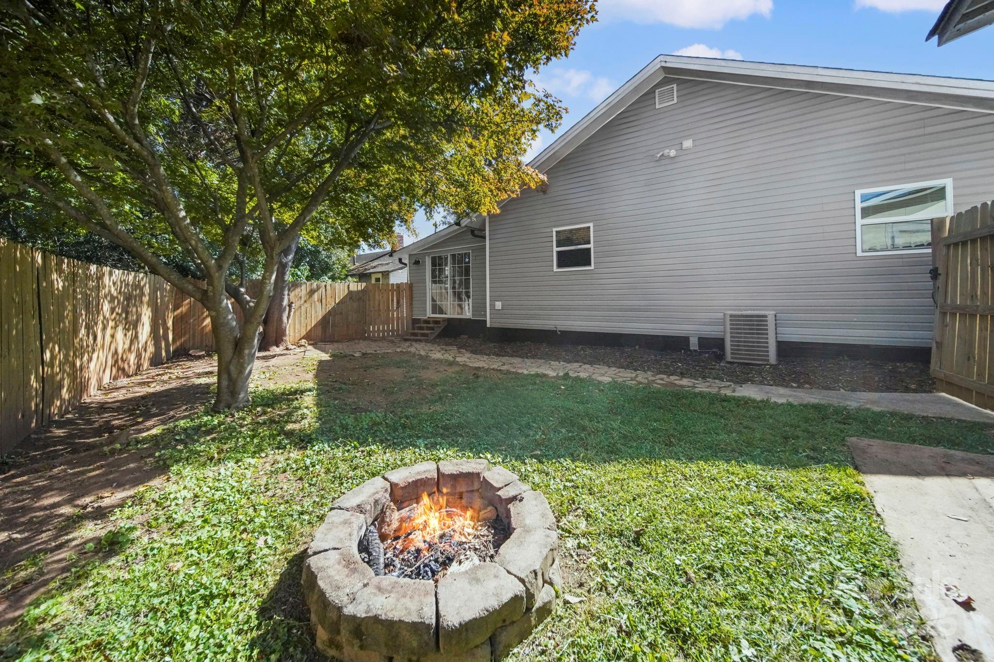 452 18th Street Cramerton, NC 28032 - Photo 32 of 35 a backyard of a house with table and chairs