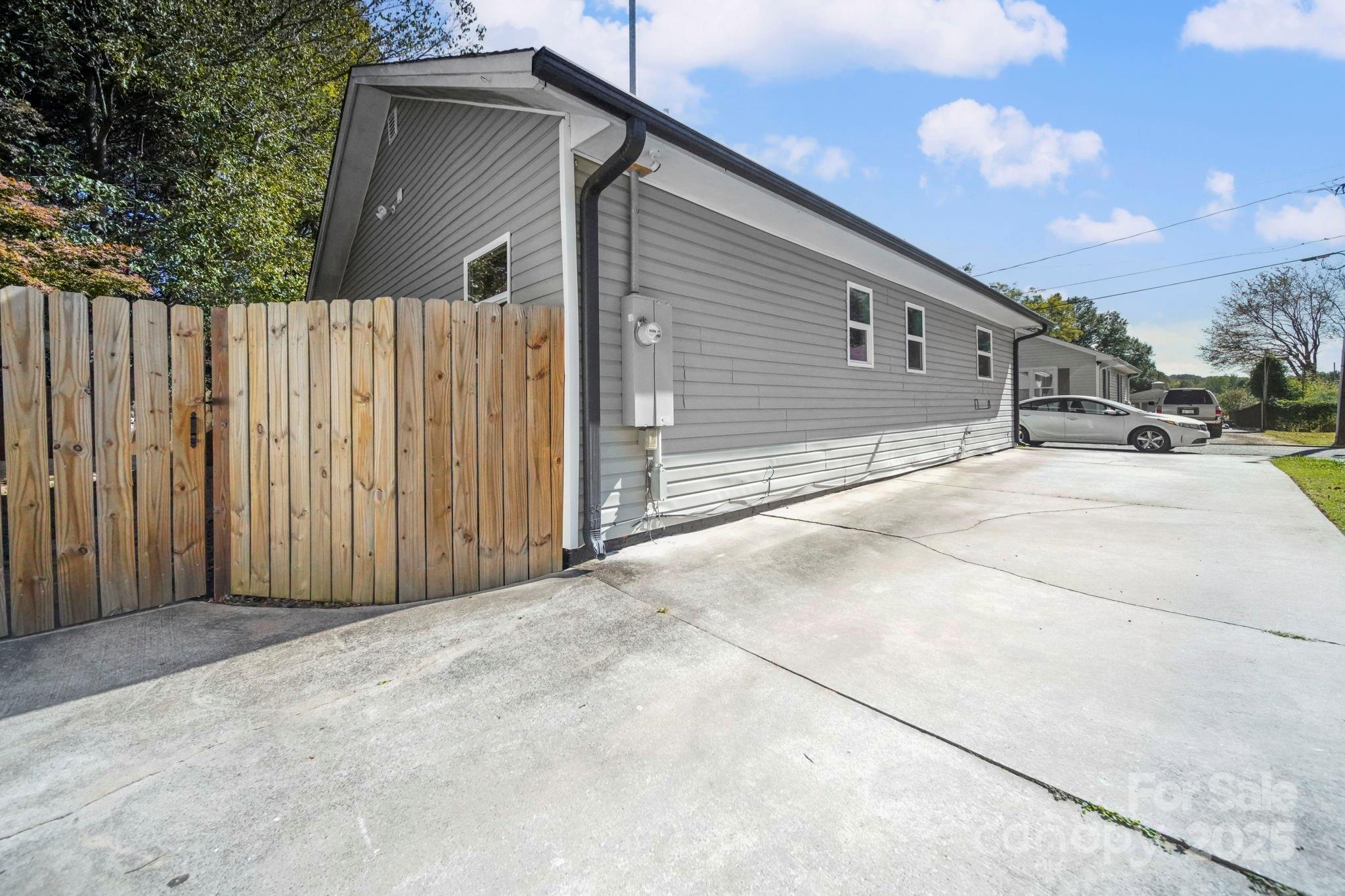 452 18th Street Cramerton, NC 28032 - Photo 35 of 35 a view of a house with wooden fence