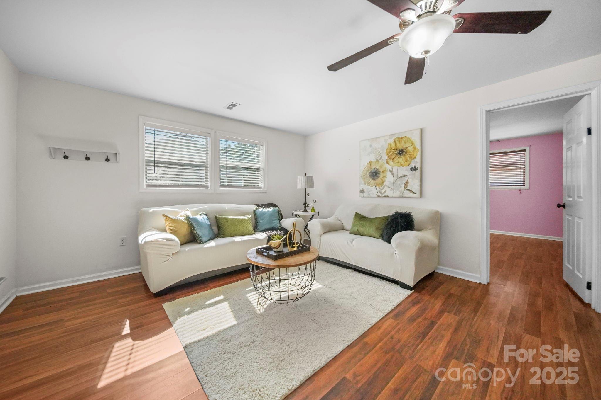 452 18th Street Cramerton, NC 28032 - Photo 6 of 35 a living room with furniture and painting on the wall