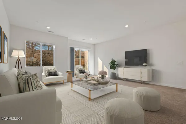 a living room with furniture a flat screen tv and a large window