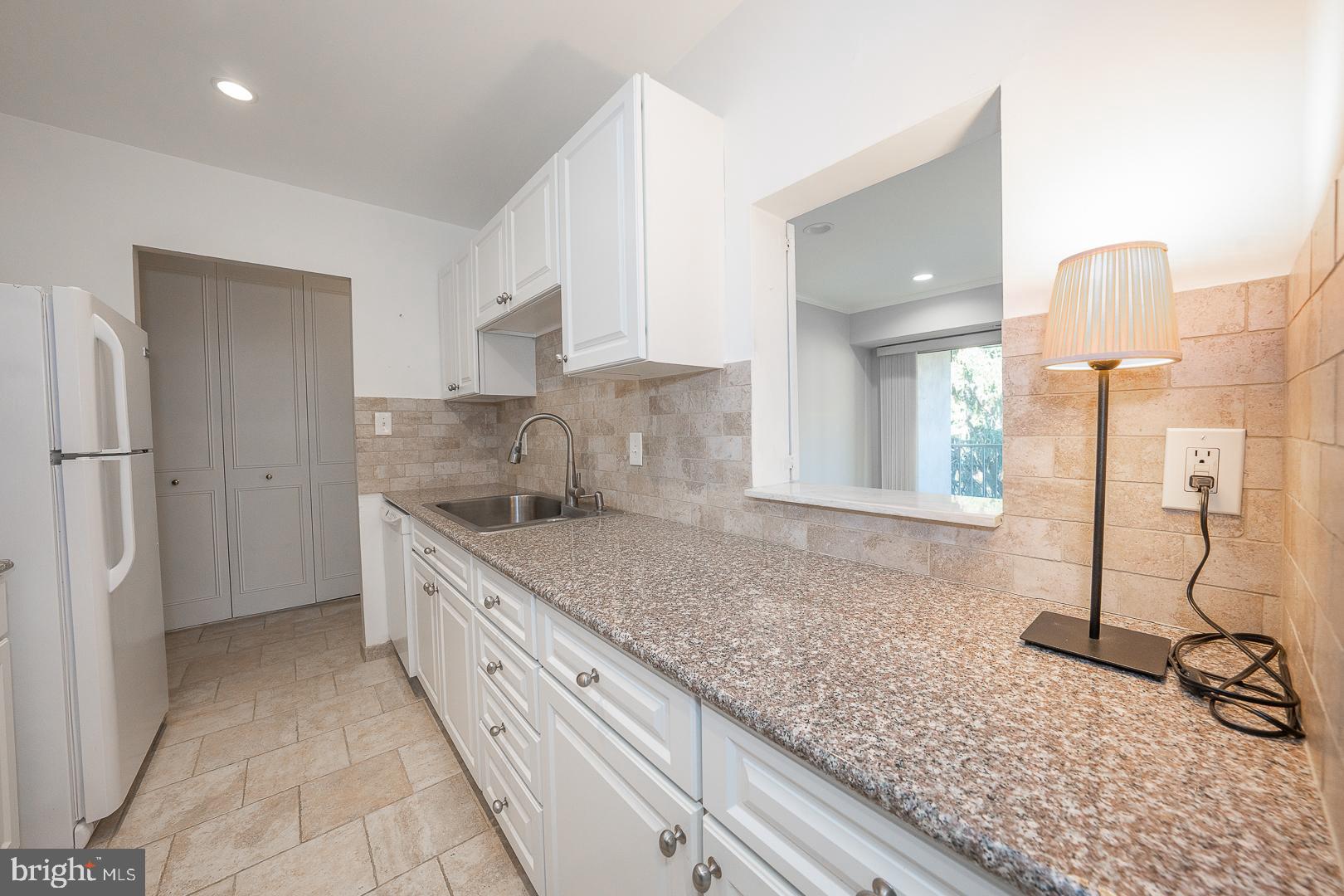 446 Drummers Lane Wayne, PA 19087 - Photo 14 of 27 a kitchen with a sink and a refrigerator