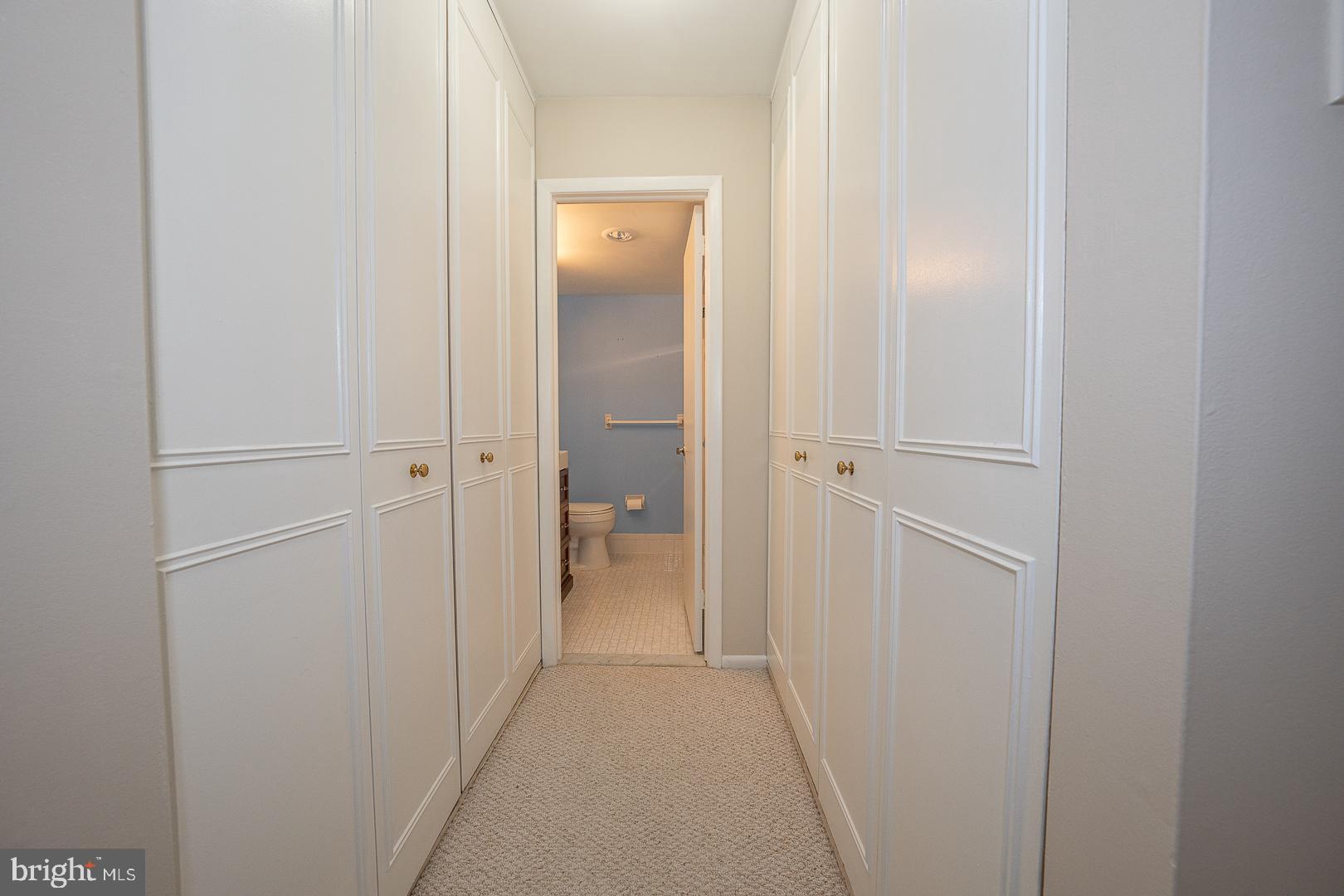 446 Drummers Lane Wayne, PA 19087 - Photo 18 of 27 a view of a bathroom from a hallway with toilet