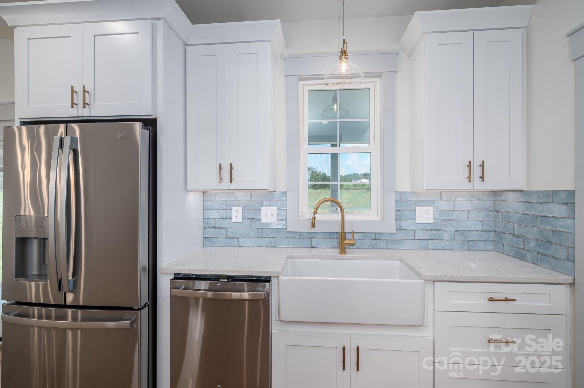 5384 Reepsville Road Vale, NC 28168 - Photo 14 of 44 a kitchen with a refrigerator sink and cabinets