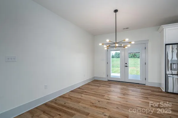 a bedroom with a large bed couch and a window