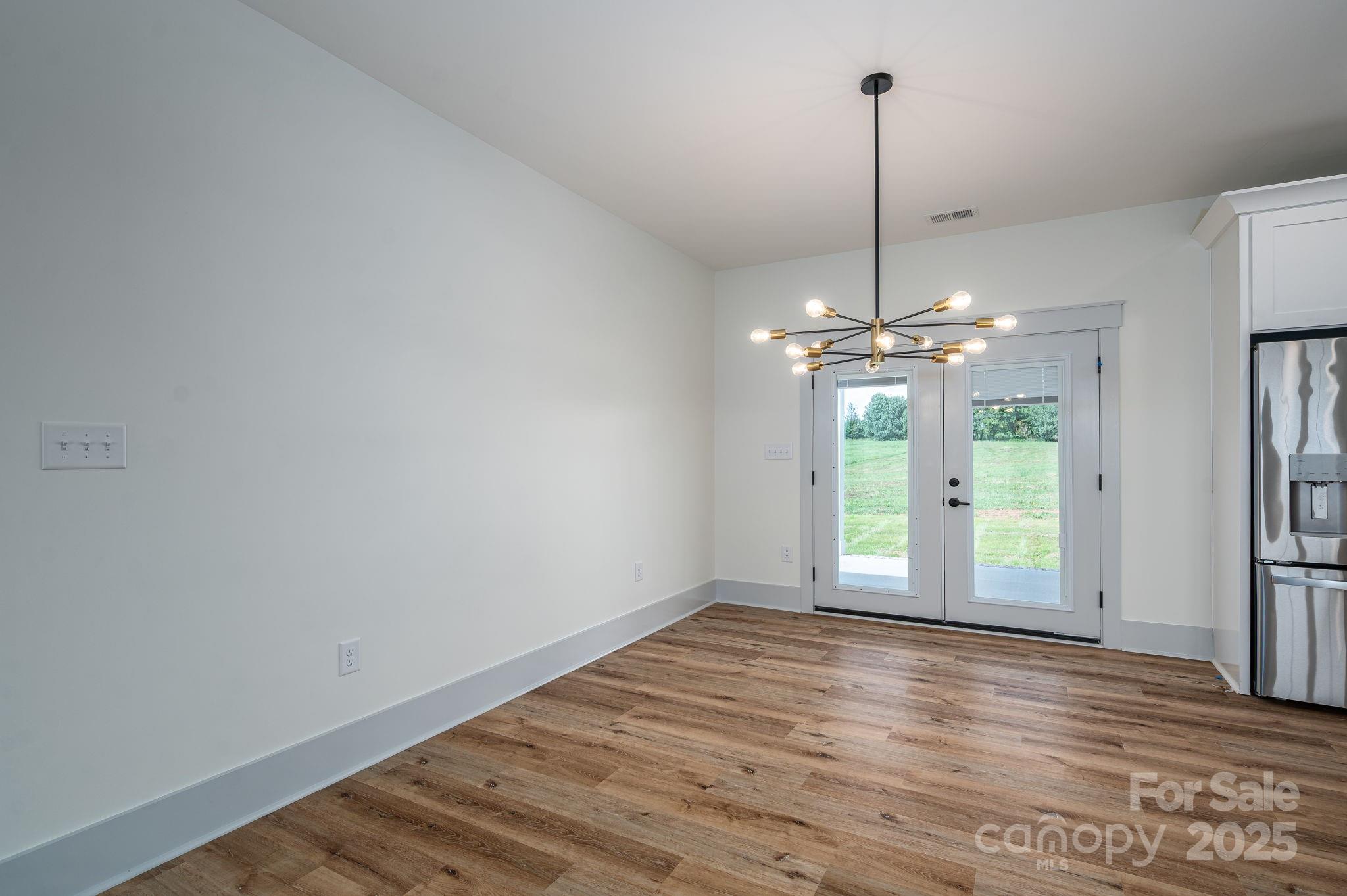 5384 Reepsville Road Vale, NC 28168 - Photo 15 of 44 a view of an empty room with window and wooden floor