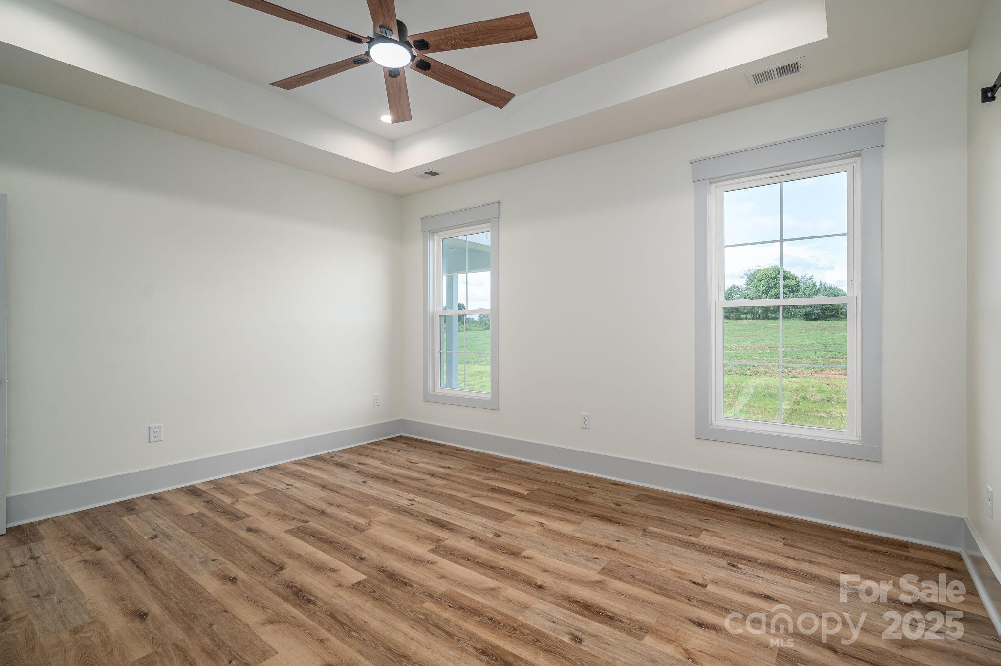 5384 Reepsville Road Vale, NC 28168 - Photo 18 of 44 a view of an empty room with wooden floor and a window