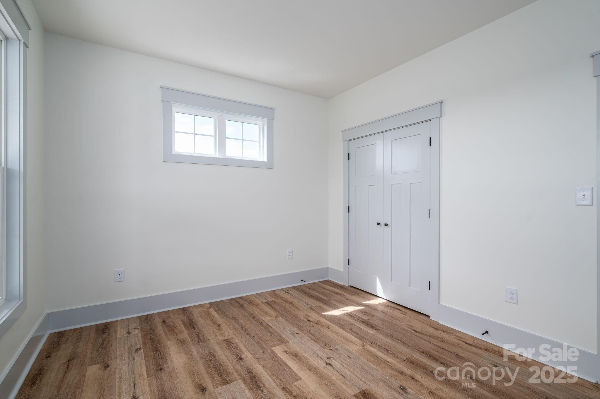5384 Reepsville Road Vale, NC 28168 - Photo 30 of 44 a view of empty room with wooden floor and fan