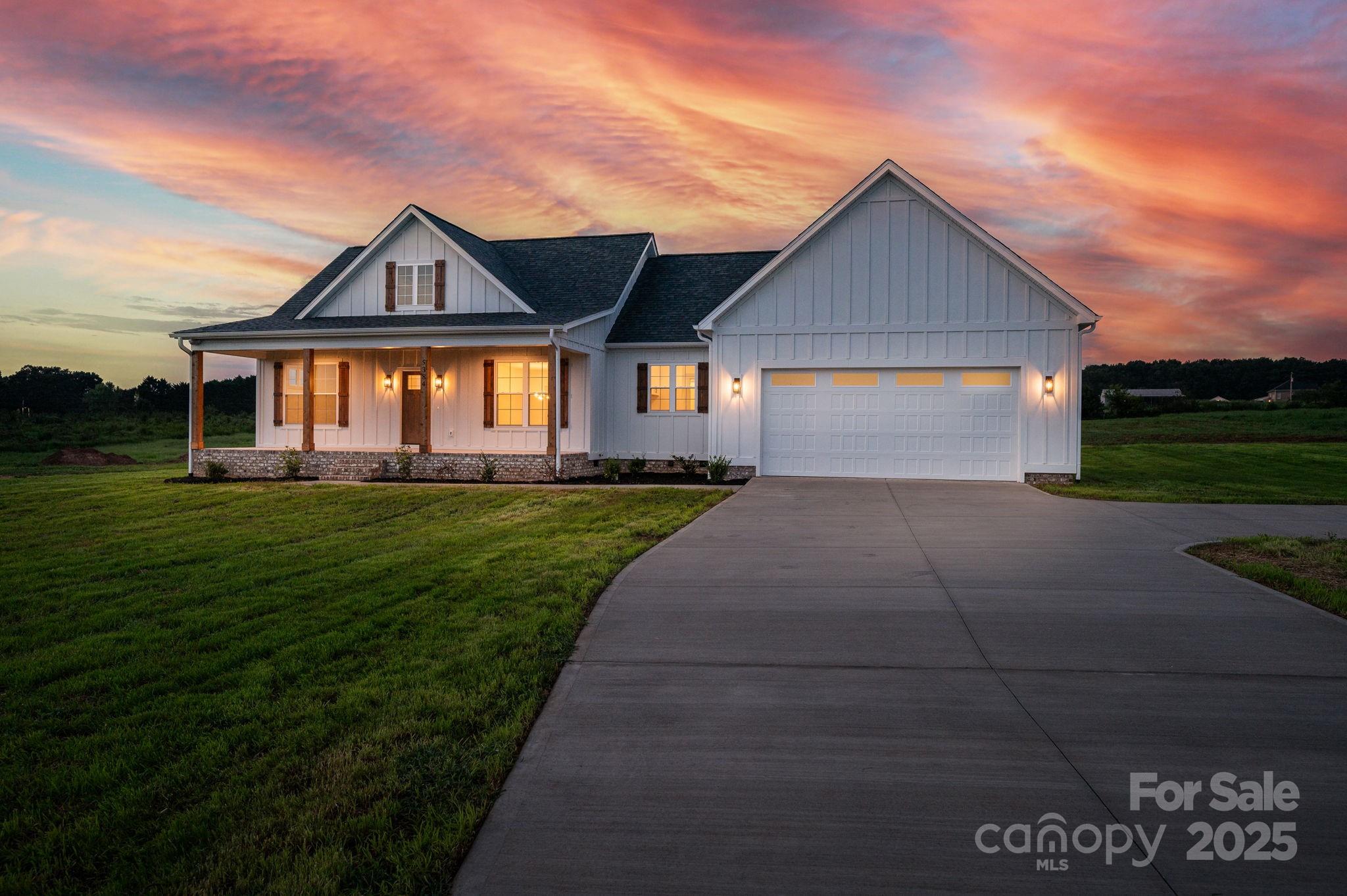 5384 Reepsville Road Vale, NC 28168 - Photo 42 of 44 a front view of a house with a yard and garage