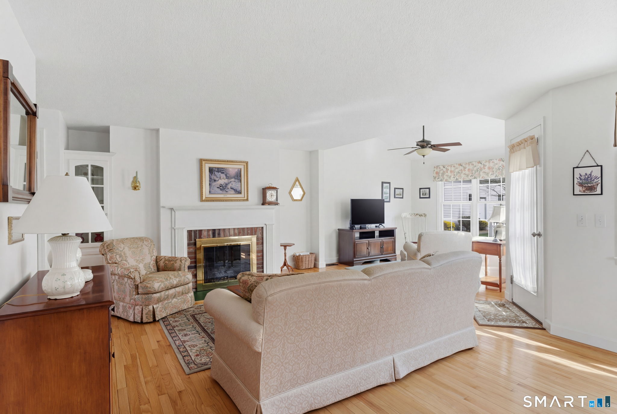 42 Dunham Street, Unit 42 Wethersfield, CT 06109 - Photo 14 of 40 a living room with furniture and a fireplace