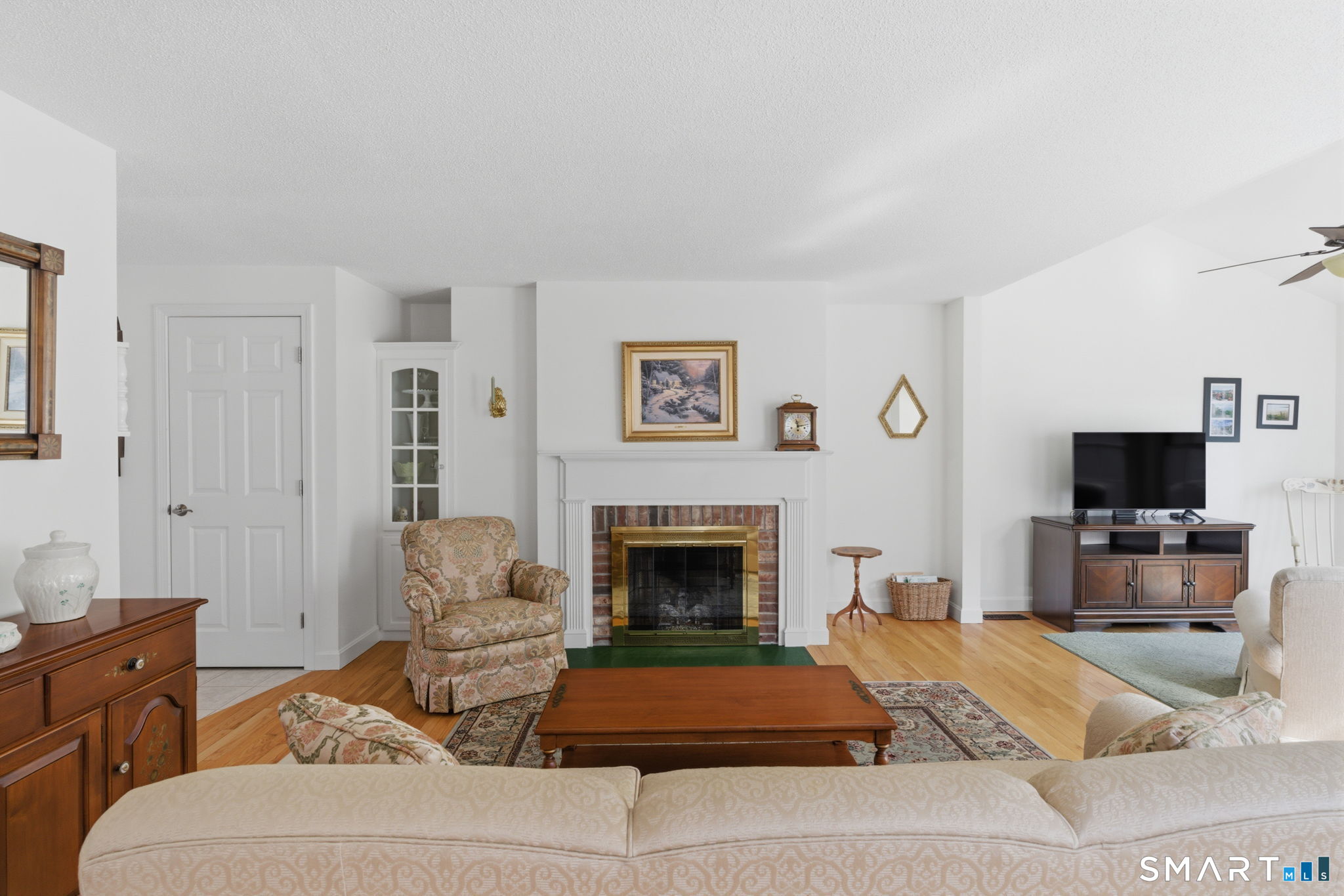 42 Dunham Street, Unit 42 Wethersfield, CT 06109 - Photo 15 of 40 a living room with furniture and a fireplace