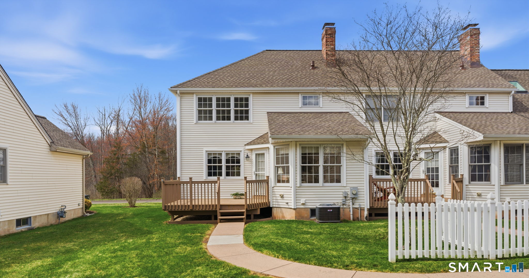 42 Dunham Street, Unit 42 Wethersfield, CT 06109 - Photo 2 of 40 a front view of a house with a yard