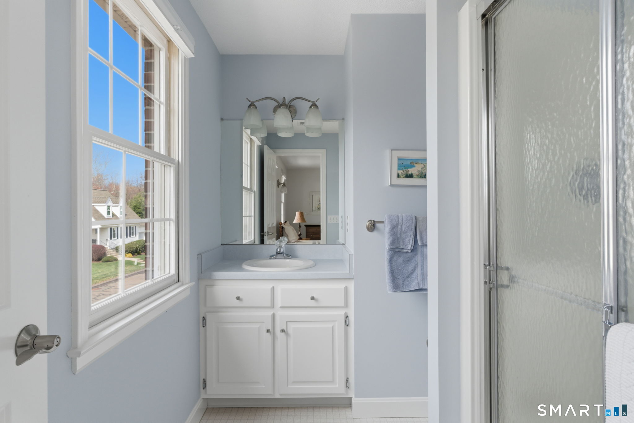 42 Dunham Street, Unit 42 Wethersfield, CT 06109 - Photo 33 of 40 a bathroom with a granite countertop sink and a mirror