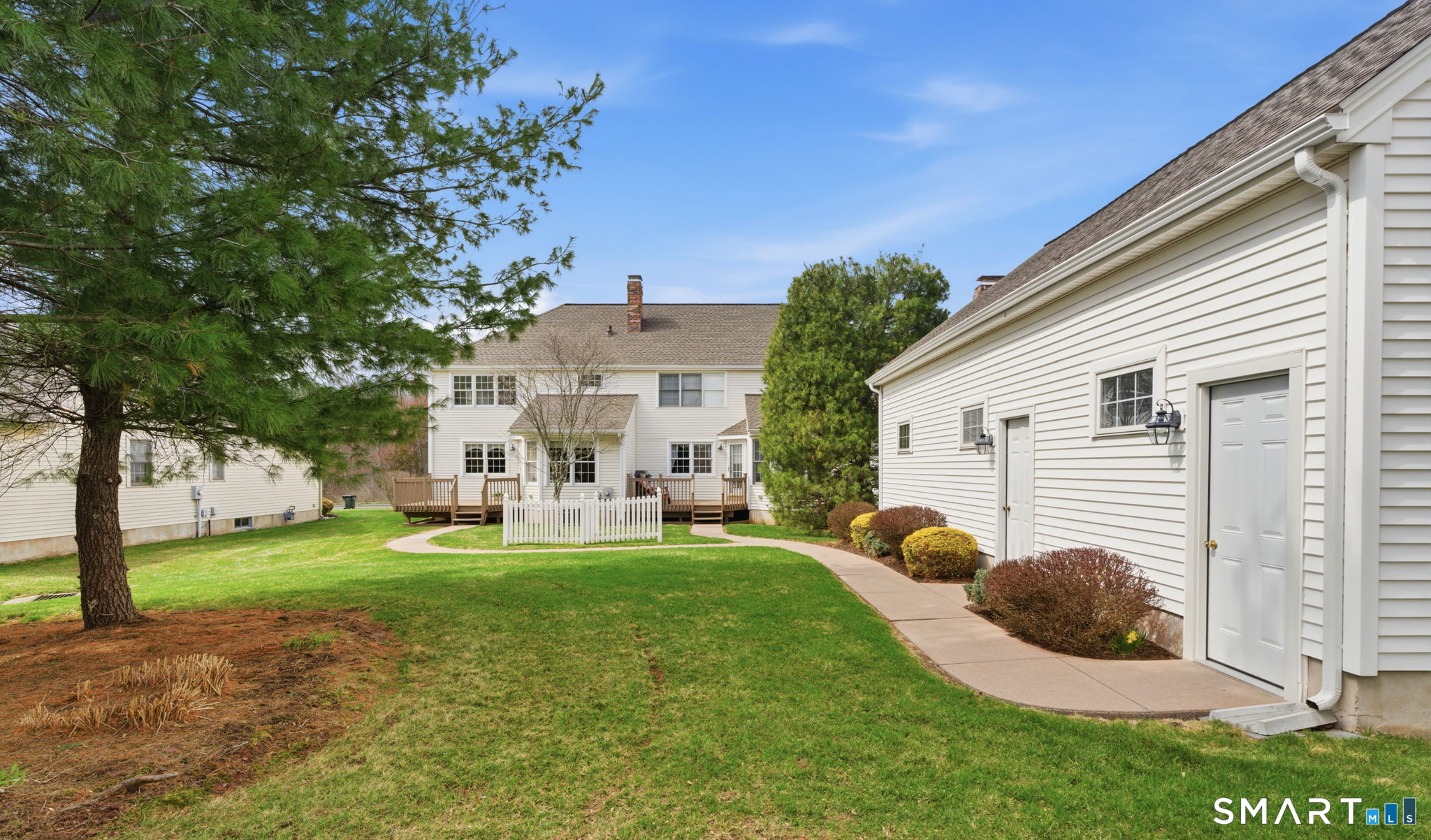42 Dunham Street, Unit 42 Wethersfield, CT 06109 - Photo 5 of 40 a view of a house with backyard and a tree