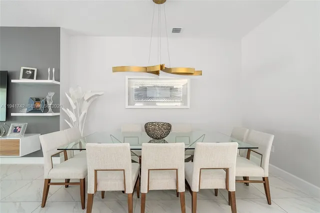 a kitchen with a sink window and white stainless steel appliances