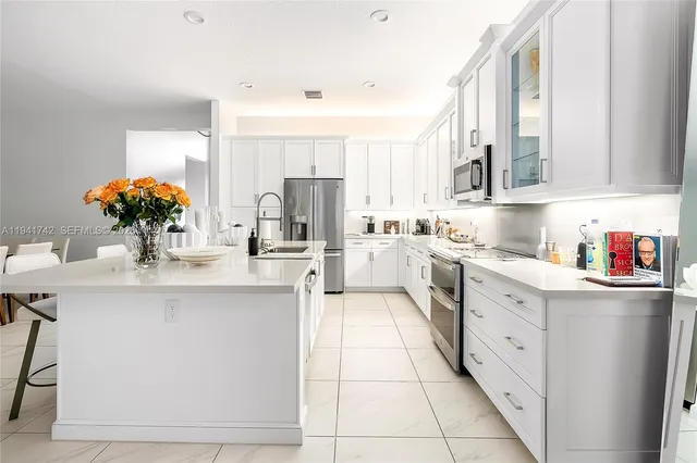 a kitchen with appliances and cabinets