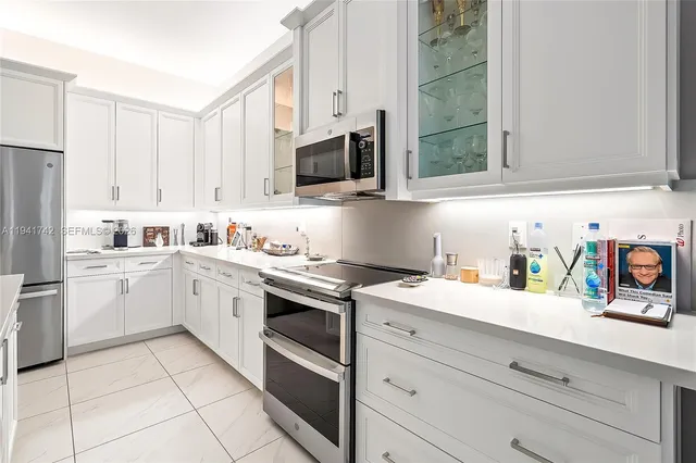 a room with a table chairs and wooden floor