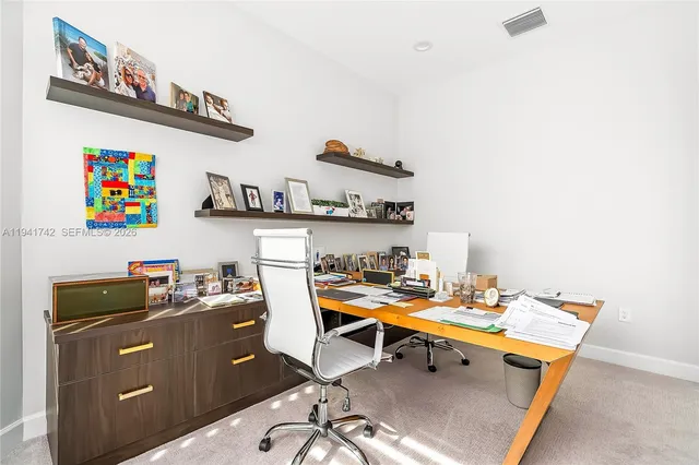 a spacious bathroom with a double vanity sink a mirror a bathtub and next to a window