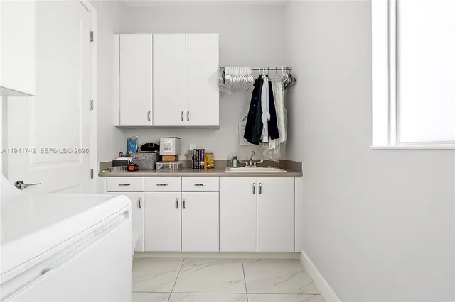 a bathroom with a shower a sink and a mirror