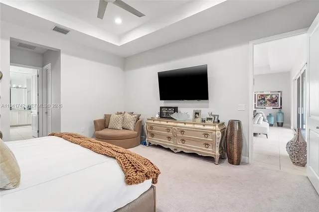 a bedroom with a bed and a couch