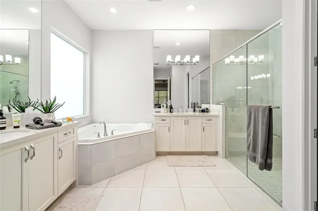 a bathroom with a sink a toilet a tub and shower