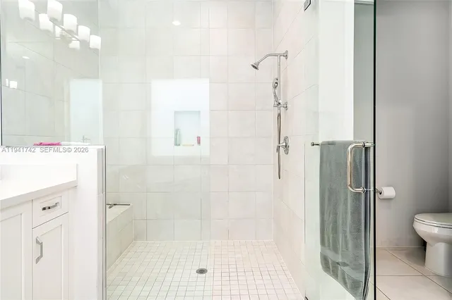 an aerial view of residential houses with outdoor space and river