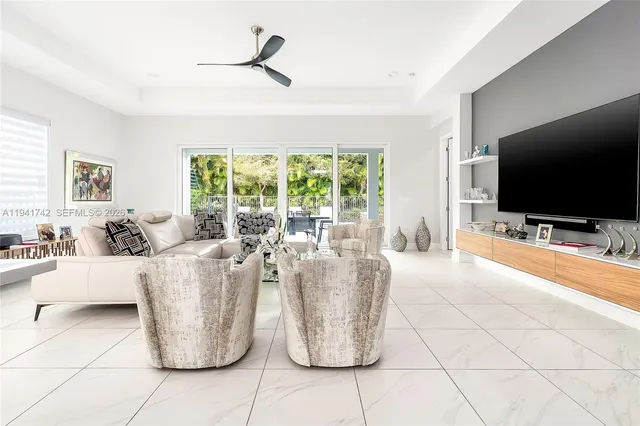 a kitchen with stainless steel appliances kitchen island granite countertop a sink and cabinets