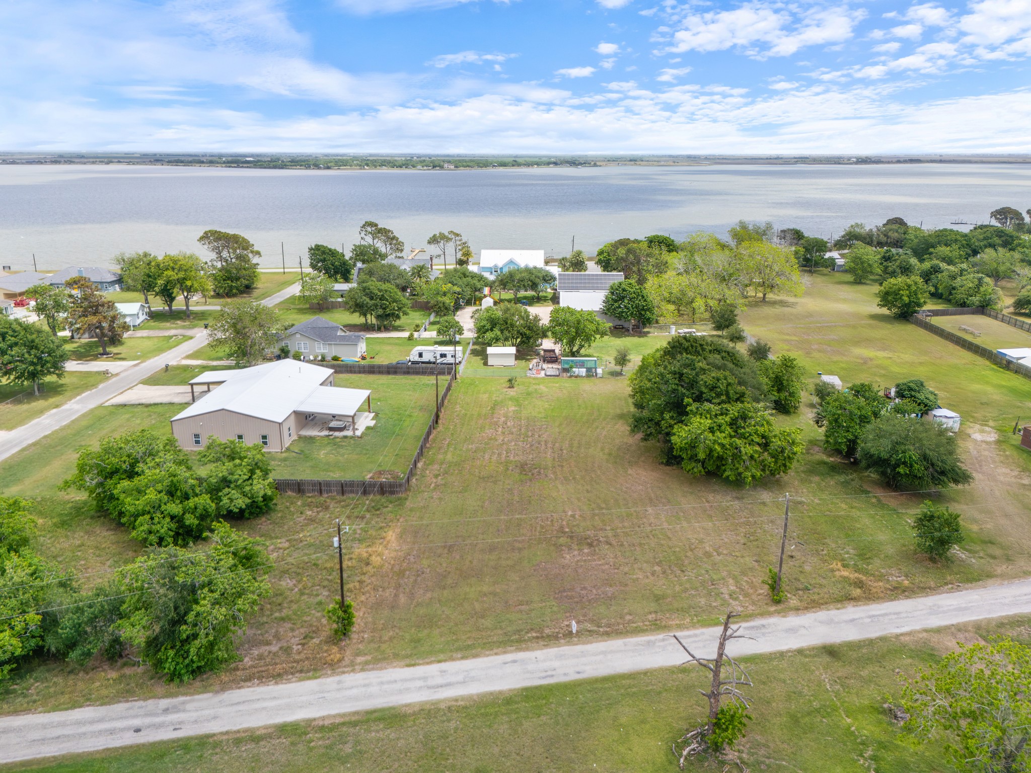 1714 Ruthven Street Palacios, TX 77465 - Photo 4 of 11 a view of a lake with a yard