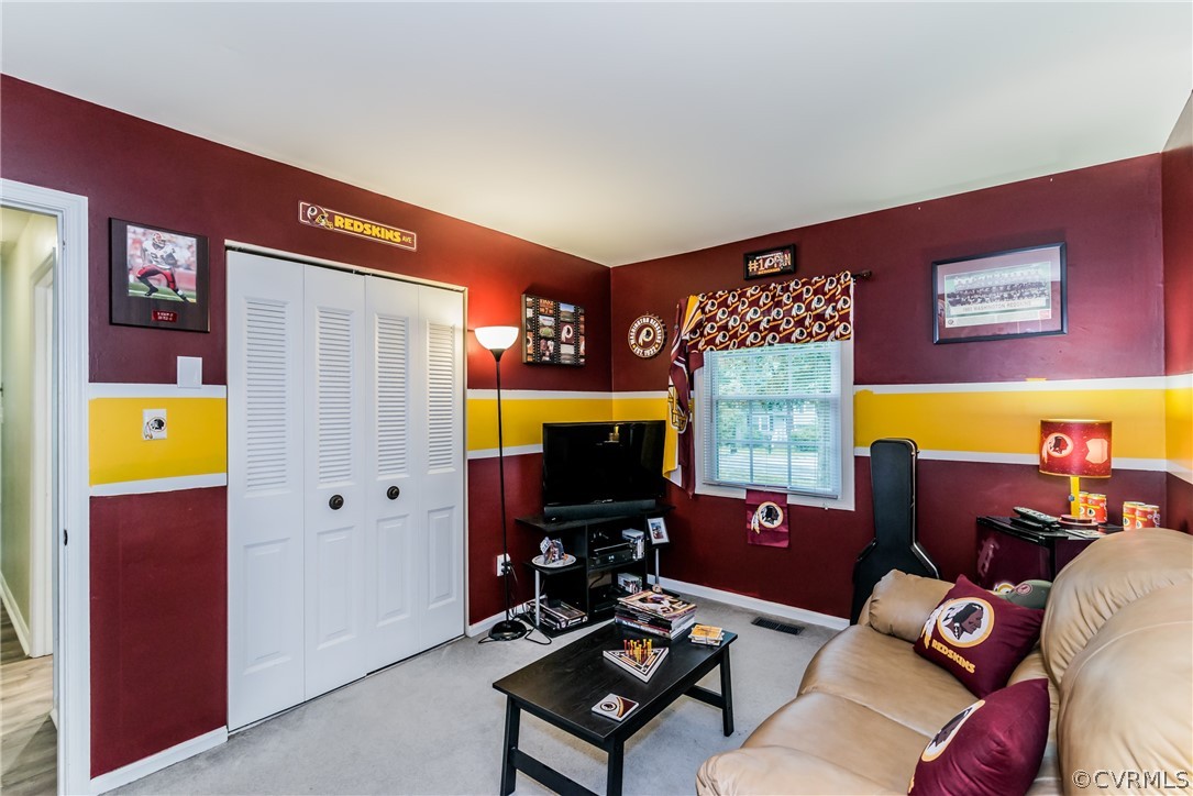 5242 Rollingway Road Chesterfield, VA 23832 - Photo 16 of 24 a living room with furniture and a flat screen tv