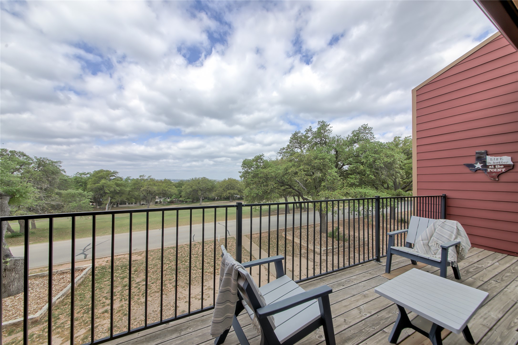 549 Demarett Drive Point Venture, TX 78645 - Photo 2 of 31 a view of a city from a roof deck