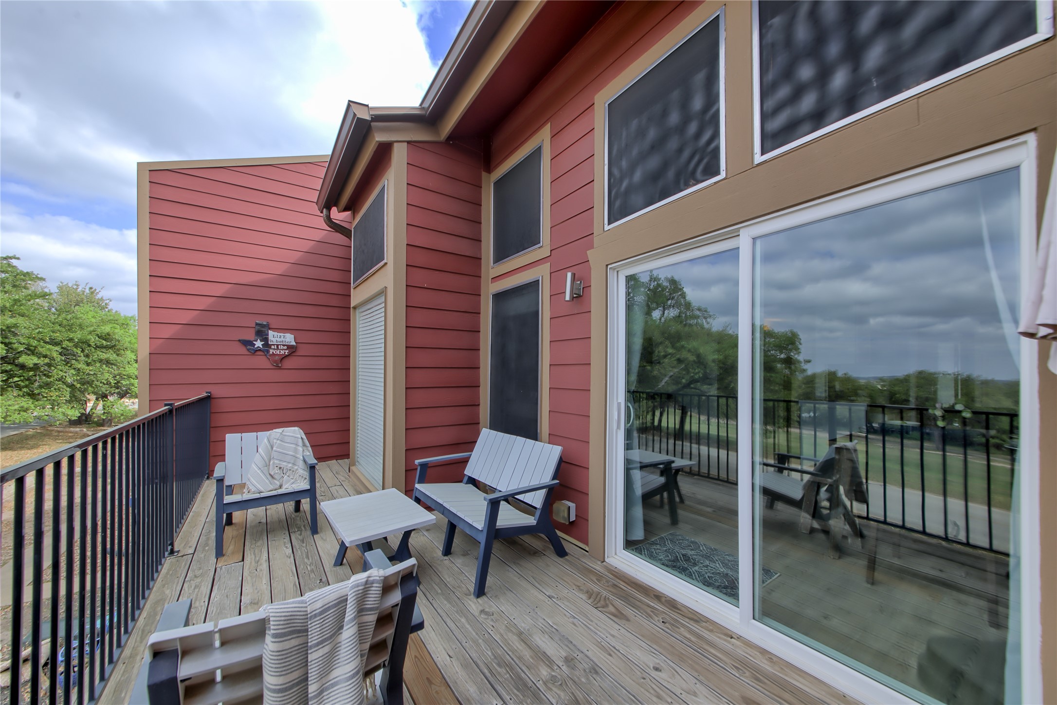 549 Demarett Drive Point Venture, TX 78645 - Photo 28 of 31 a patio with table and chairs
