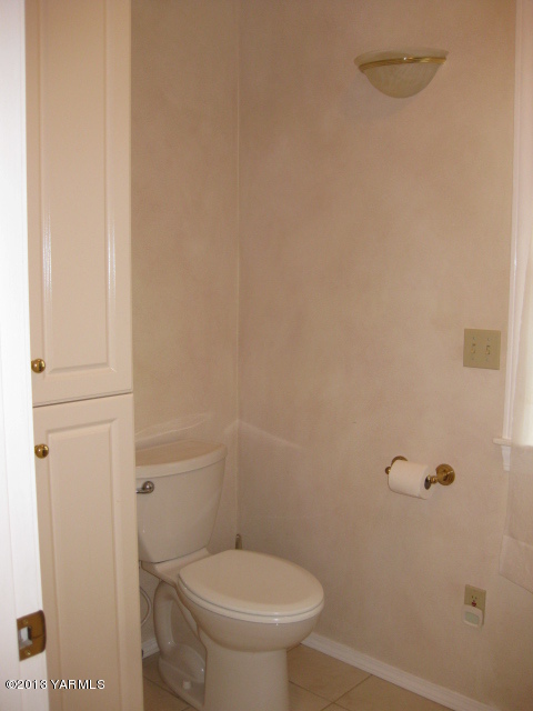 9530 Mieras Road Yakima, WA 98901 - Photo 21 of 55 a white toilet sitting next to a shower