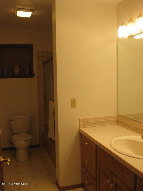 9530 Mieras Road Yakima, WA 98901 - Photo 25 of 55 a bathroom with a sink a toilet and shower