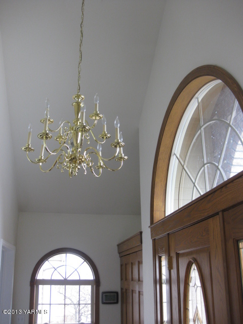 9530 Mieras Road Yakima, WA 98901 - Photo 6 of 55 a view of a livingroom with a large window and a chandelier