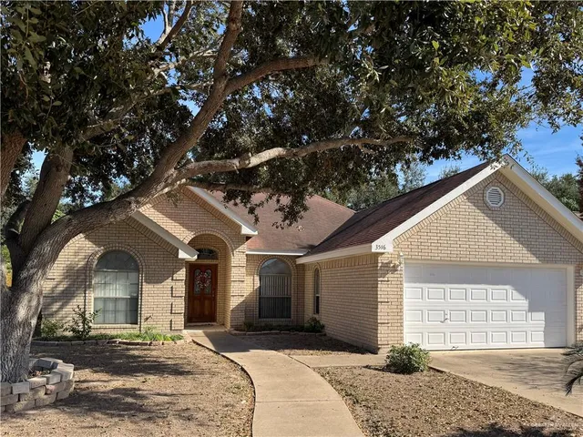 a front view of a house with a outdoor space