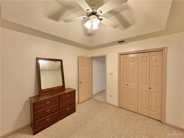 a room with a dresser and a mirror