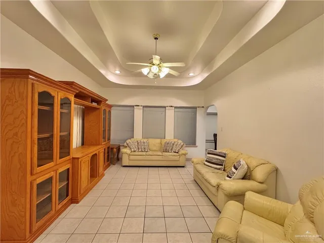 a living room with furniture and white walls