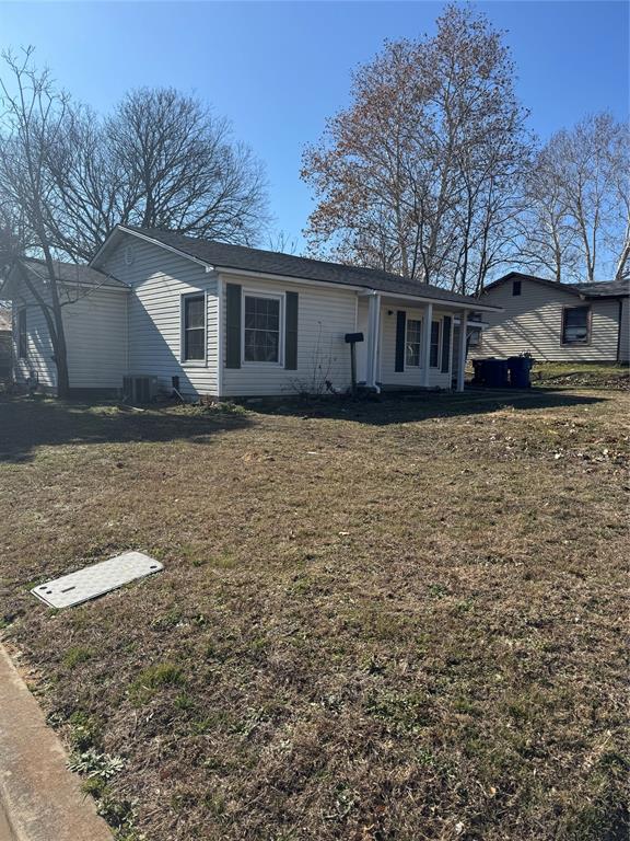 214 East Acheson Street Denison, TX 75021 - Photo 1 of 20 a front view of a house with yard